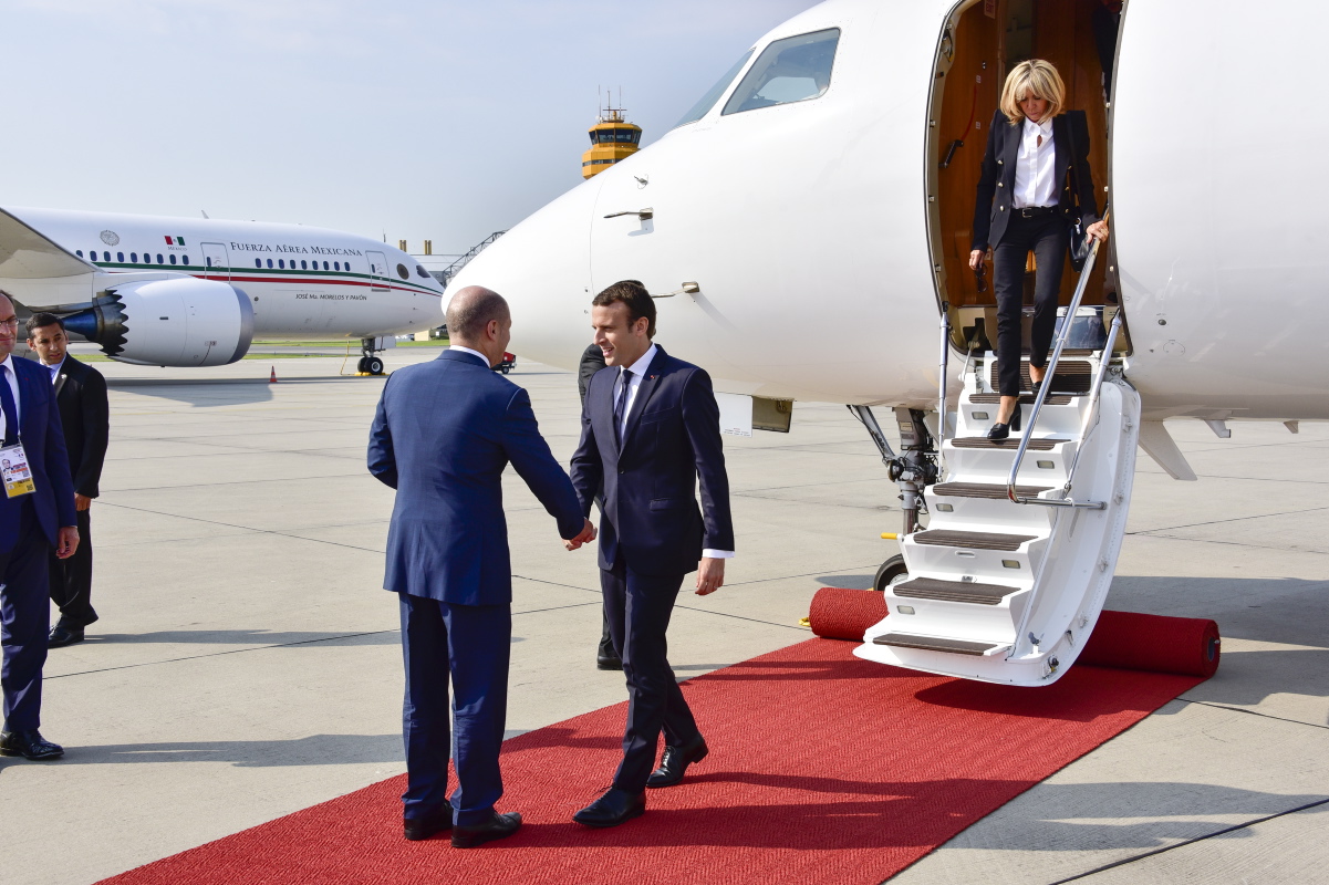 Olaf Scholz, First Mayor of Hamburg, welcomes French President Emmanuel Macron and his wife Brigitte at Hamburg Airport. 