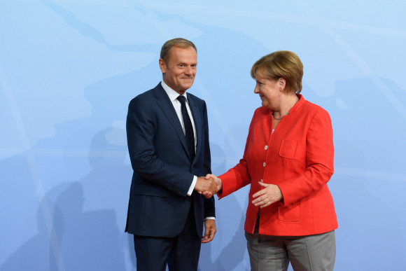Federal Chancellor Angela Merkel welcomes Donald Tusk, President of the European Council, to the G20 Summit at the Hamburg Trade Fair site (Hamburg Messe).
