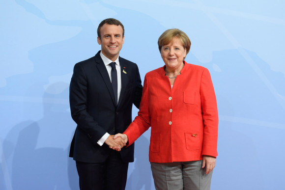 Federal Chancellor Angela Merkel welcomes French President Emmanuel Macron to the G20 Summit in Hamburg.
