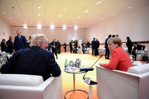 Federal Chancellor Angela Merkel in conversation with US President Donald Trump before the beginning of a retreat on counter-terrorism.