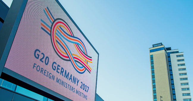 The 'G20 Germany 2017' logo is lit up on 15 February 2017 in front of the World Conference Center in Bonn